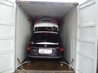 international shipping cars inside of containers